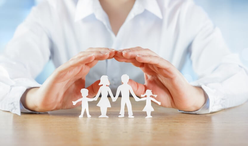 4 Types of Insurance - hands protecting paper cut-out family