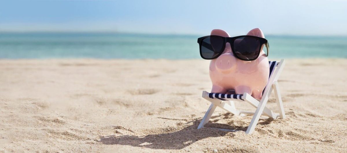 A pig with a sunglass having a vacation on a beach